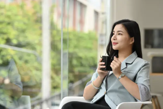 woman having coffee outside the clinic